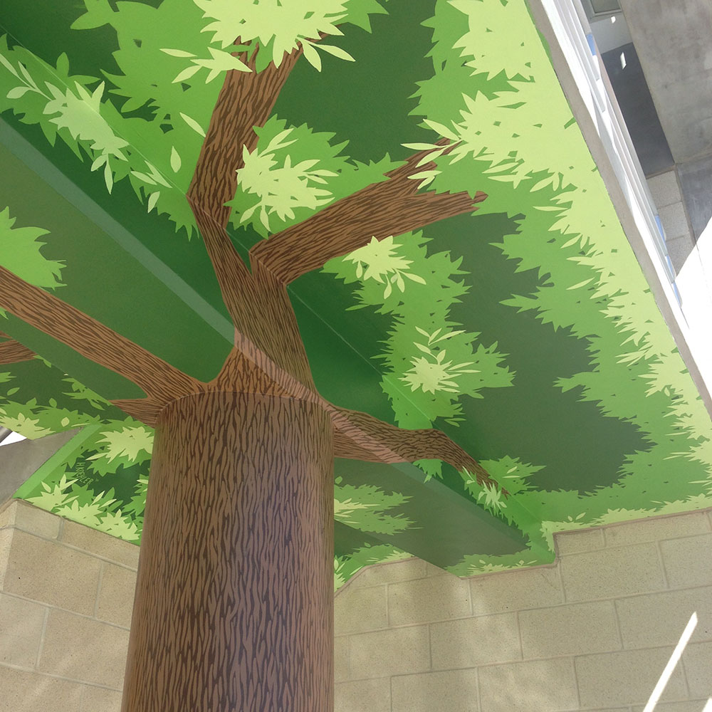 Upward view of painted branches and leaves.